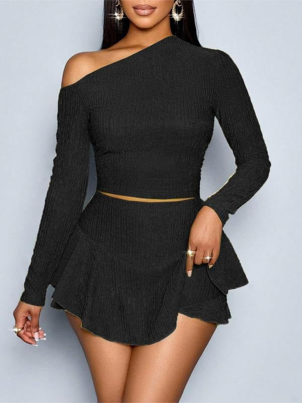 Elegant black one-shoulder sculpted two-piece set, perfect for party wear, featuring a mini skirt