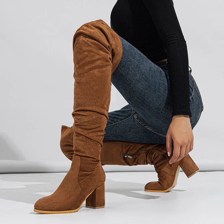 Close-up of the heel and shaft of women's over-the-knee boots, showcasing quality design.