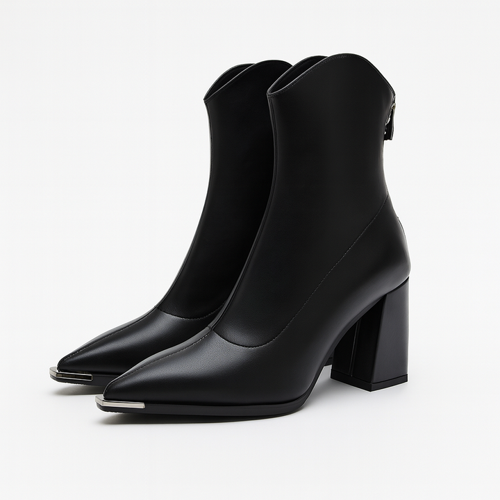 Close-up of women's pointed heel ankle boots, showcasing the sleek design and high-quality material.