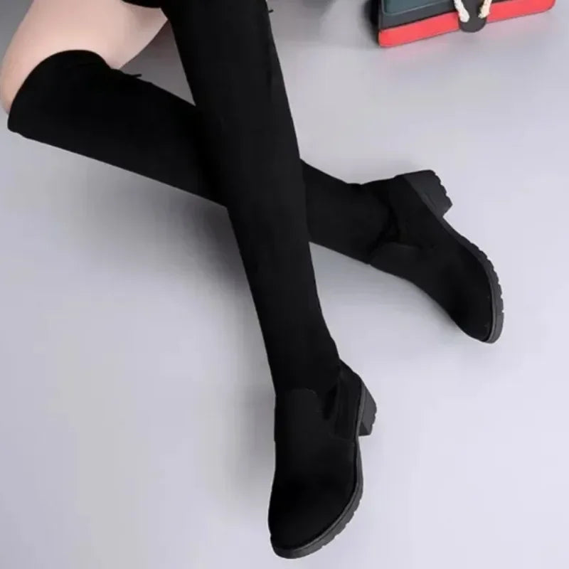 Women's sleek thigh-high boots with a stylish block heel, offering a fashionable and comfortable fit.