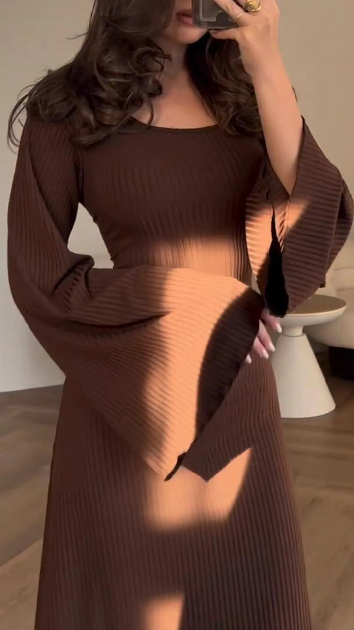 Stylish women's elegant bodycon maxi dress, long sleeve, with intricate corset lacing detail.