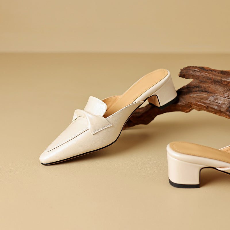 Sophisticated black leather bow mules, women's slip-on shoes for an elegant look