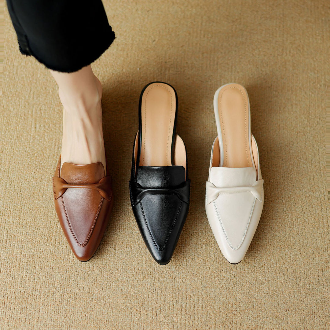 White leather bow mules, a perfect example of chic and comfortable women's footwear