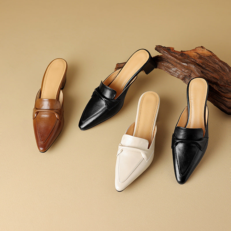 Black leather elegant mules for women with a bow detail, ideal for any occasion