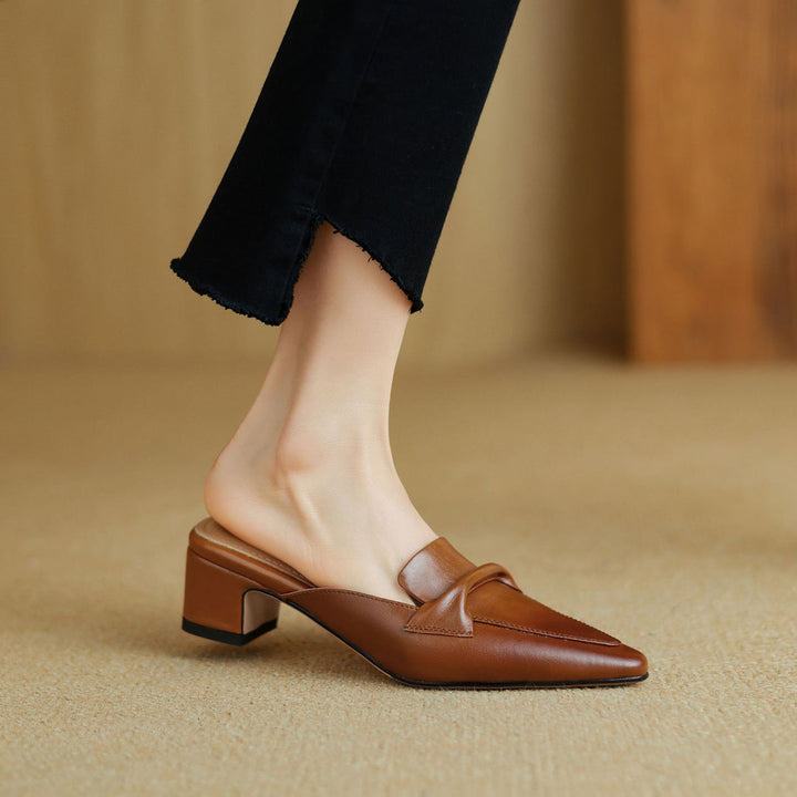 Stylish brown leather bow mules, a comfortable and elegant addition to women's shoe collection