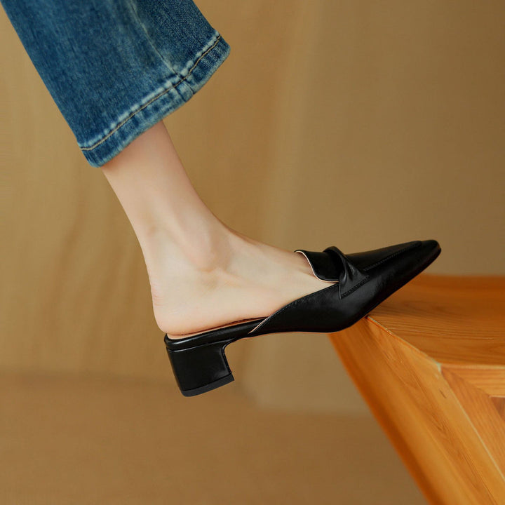 Collection of women's leather bow mules in brown, white, and black, emphasizing elegance and comfort