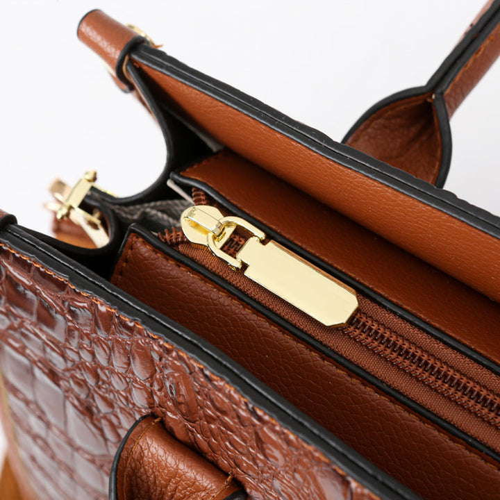 Stylish croc-embossed women's tote bag, offering ample space and a chic silhouette