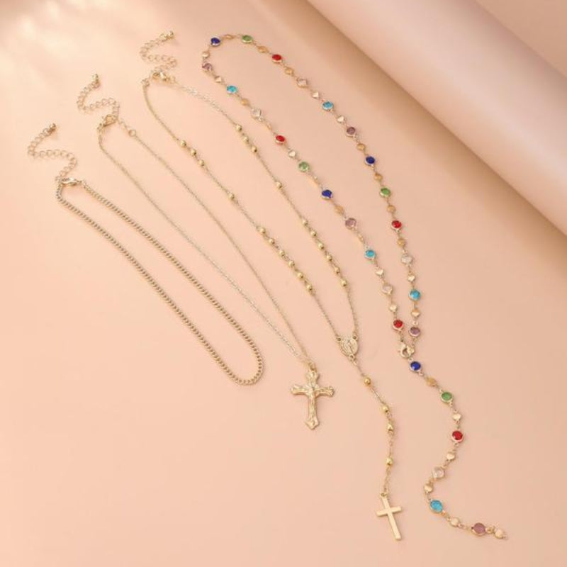 Women's shimmering silver-tone cross pendant layered necklace, adorned with delicate crystal accents.
