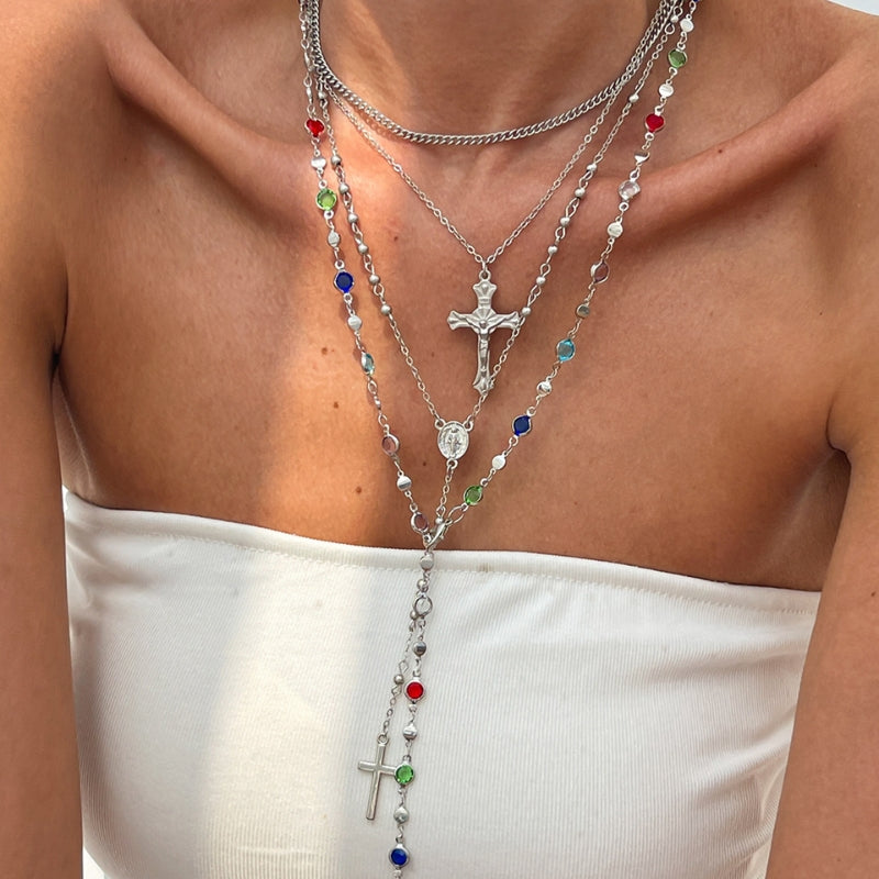 Fashionable women's layered necklace set showcasing a crystal-embellished cross pendant in silver.