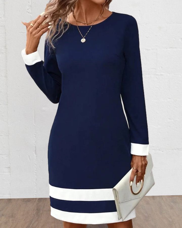 Flattering dark blue classic women's cocktail dress, ideal for parties & versatile elegant fashion.