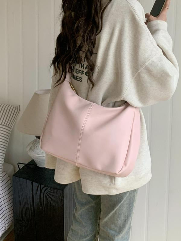 Close-up of elegant faux leather shoulder bag texture, showcasing quality and minimalist design