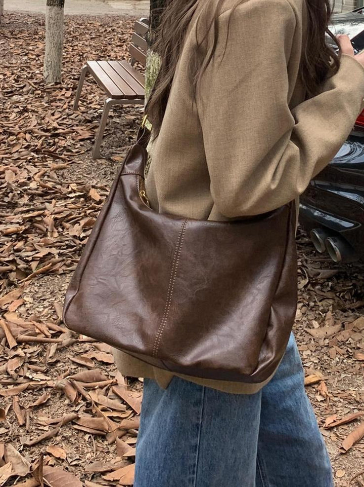 Minimalist faux leather handbag, an elegant shoulder bag for modern women