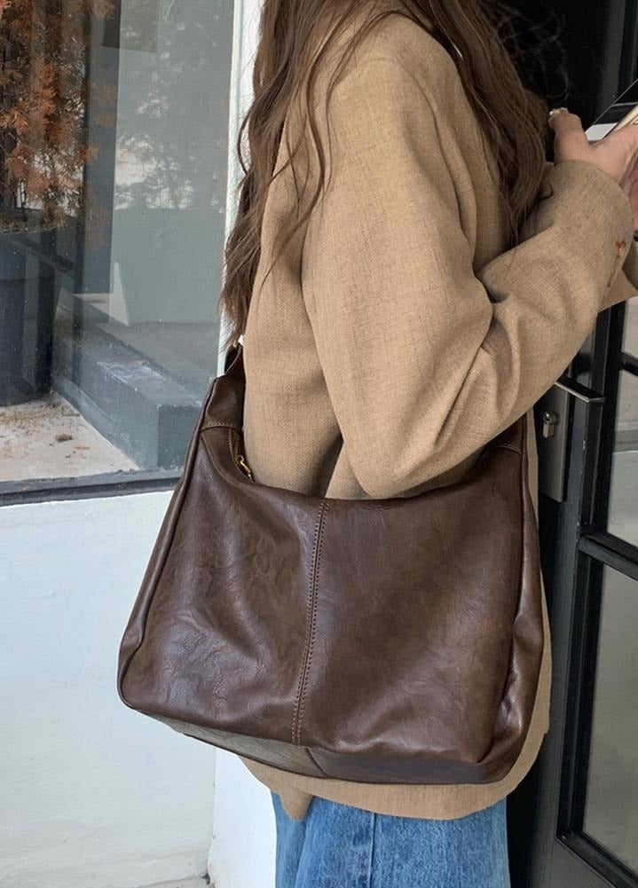 Front view of women's sophisticated faux leather shoulder bag, ideal for any occasion