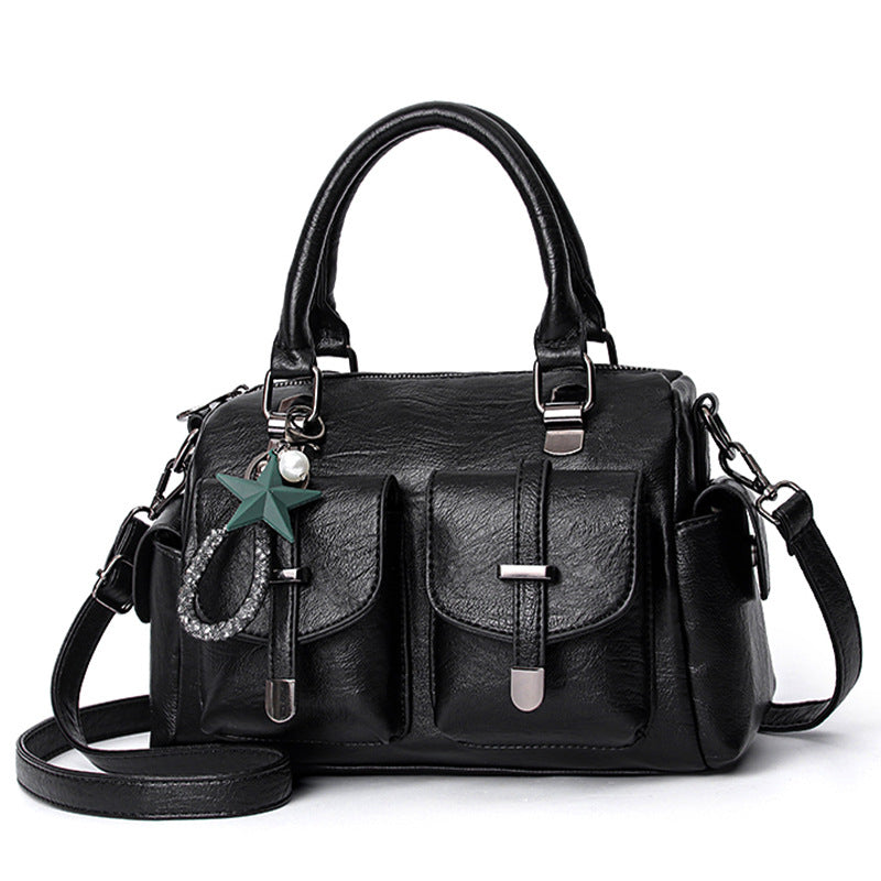 Stylish women's faux leather shoulder bag with ample space, an elegant and functional accessory.