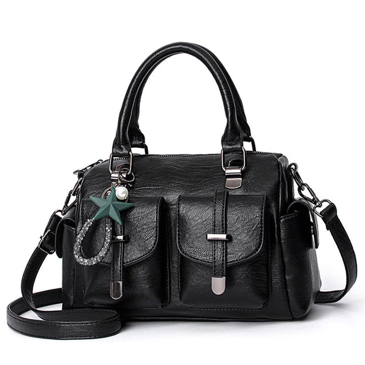 Stylish women's faux leather shoulder bag with ample space, an elegant and functional accessory.