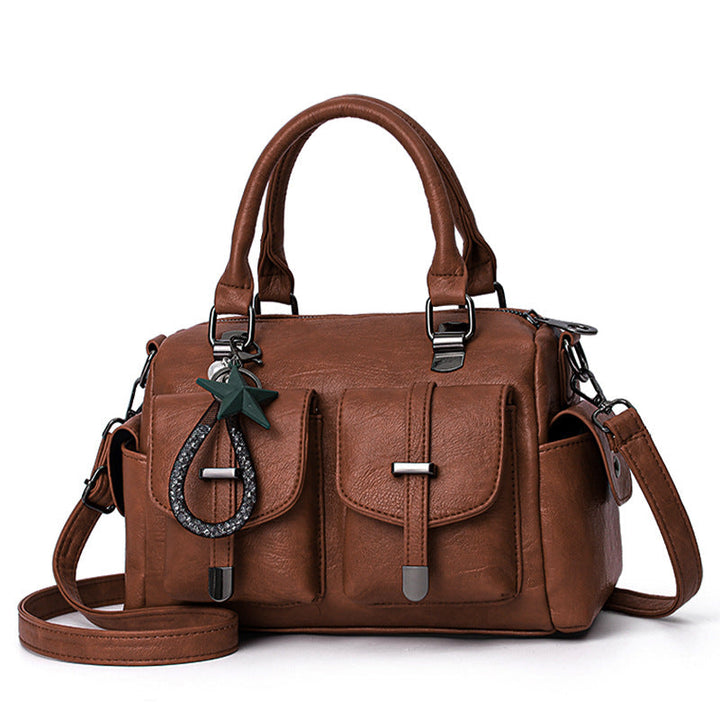 Women's faux leather shoulder bag styled as a crossbody, demonstrating its versatility and comfort.
