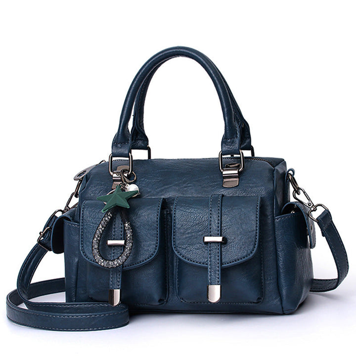 Collection of women's faux leather shoulder bags in red, brown, black, and blue, highlighting color options.