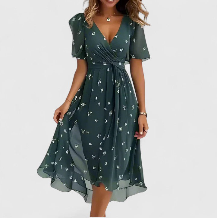 Woman wearing an elegant floral plunge V-neck flutter sleeve midi dress, front view. Ideal for parties.