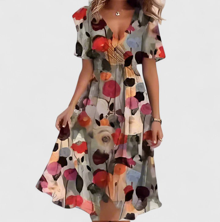 Detail of the delicate flutter sleeves on a women's floral midi dress, plunge V-neck. Perfect for summer.