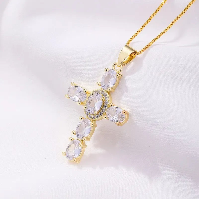 Elegant gold plated cross pendant necklace with sparkling cubic zirconia, perfect for women's religious jewelry