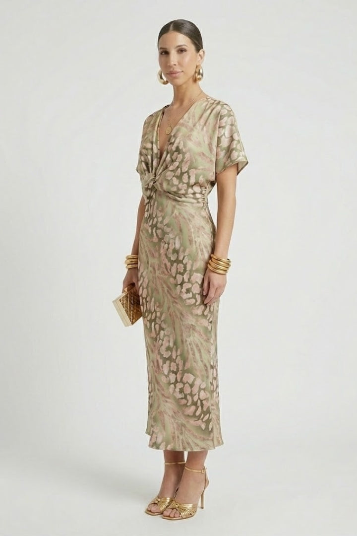 Stylish green floral midi dress for women, V-neck, short sleeves & pleated skirt; a comfortable choice for summer.