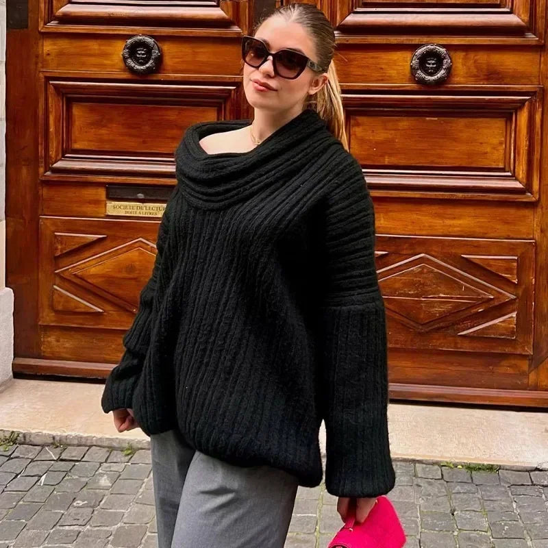 Full view of a women's elegant off-shoulder ribbed knit sweater, highlighting its flattering design