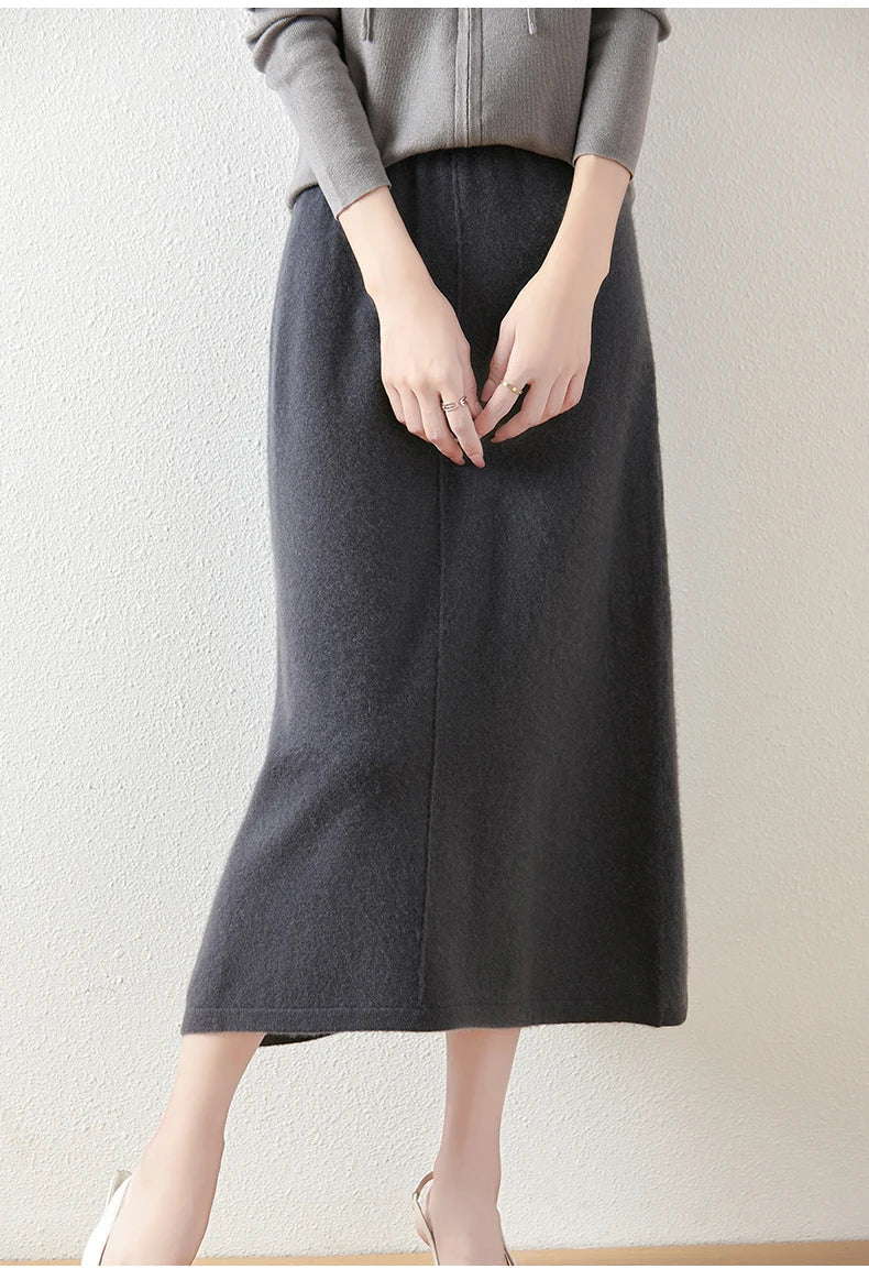Women's high-waisted olive merino wool knit maxi skirt, a must-have for a chic and cozy winter ensemble.