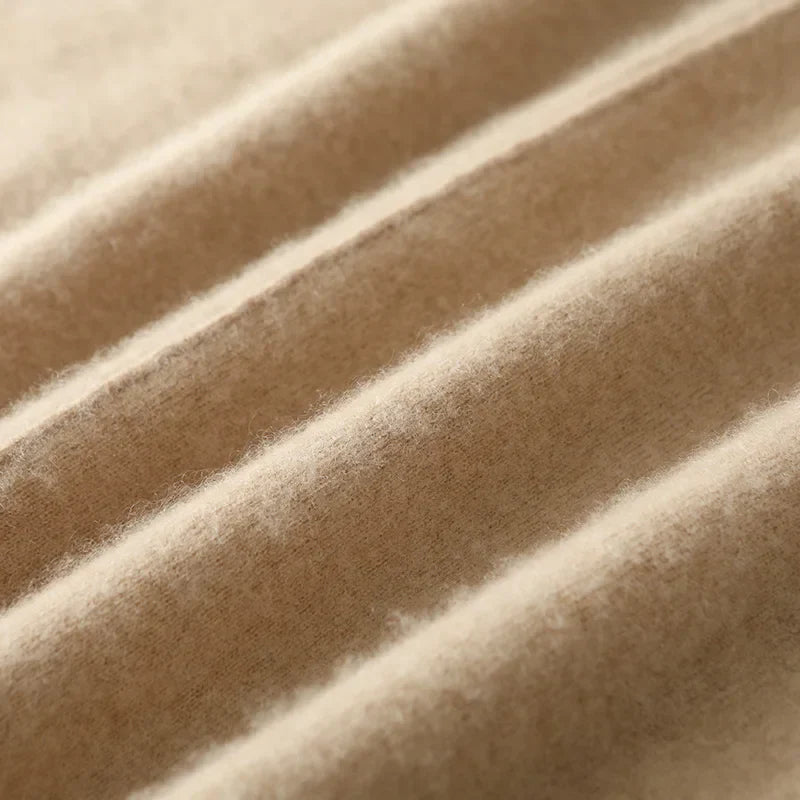 Olive merino wool knit maxi skirt, focusing on the fine stitching and durable construction for long wear.