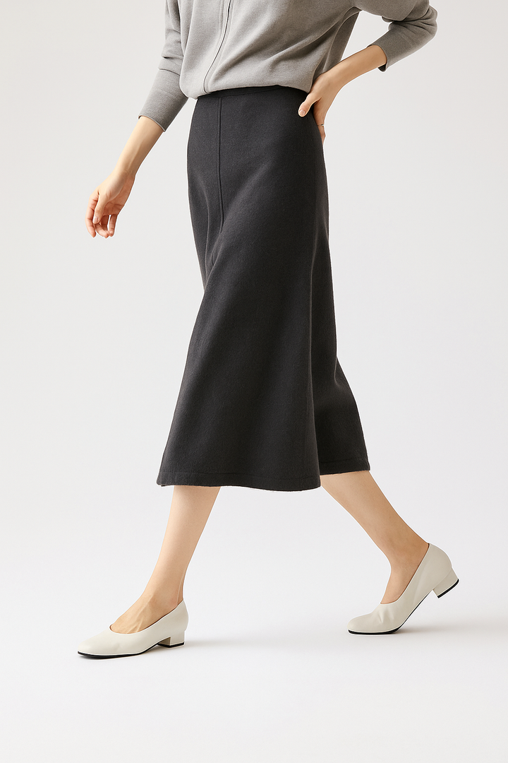 High-waisted olive merino wool knit maxi skirt, a versatile and elegant addition to any winter wardrobe.