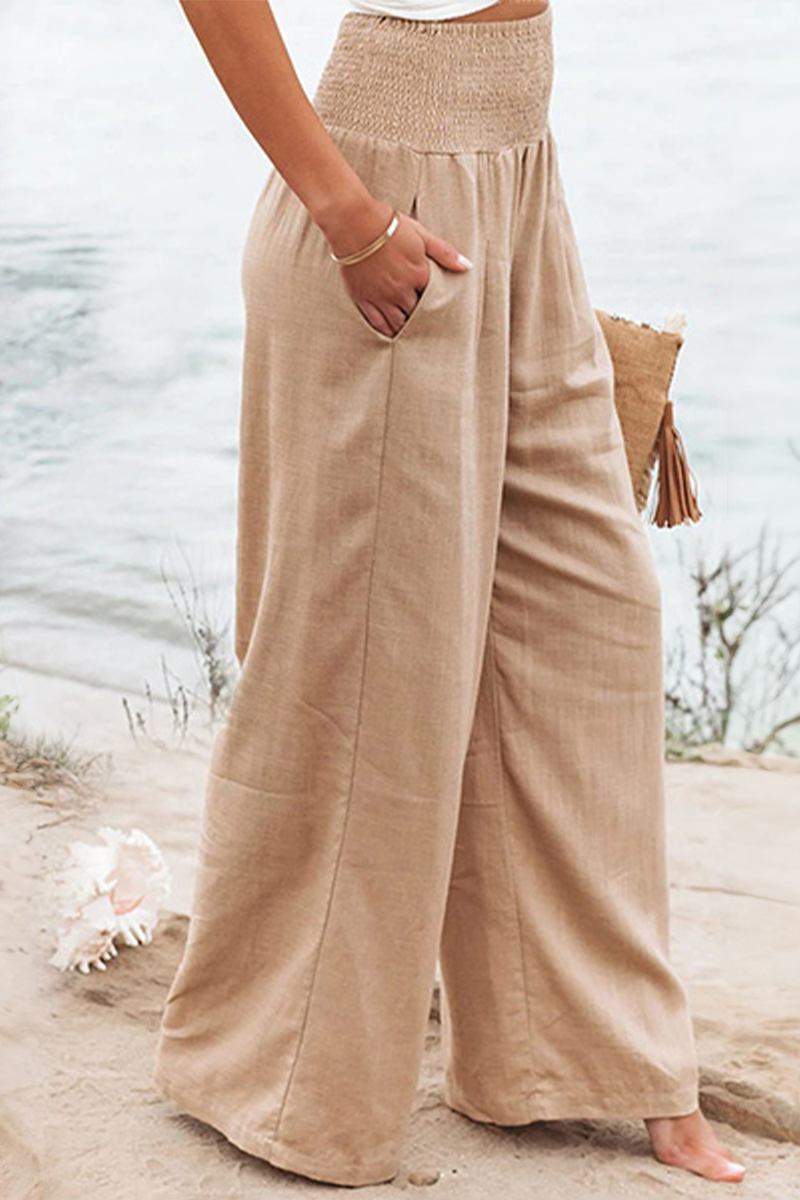 Flowy high-waist palazzo trousers for women, ideal for an effortless boho summer vacation outfit.