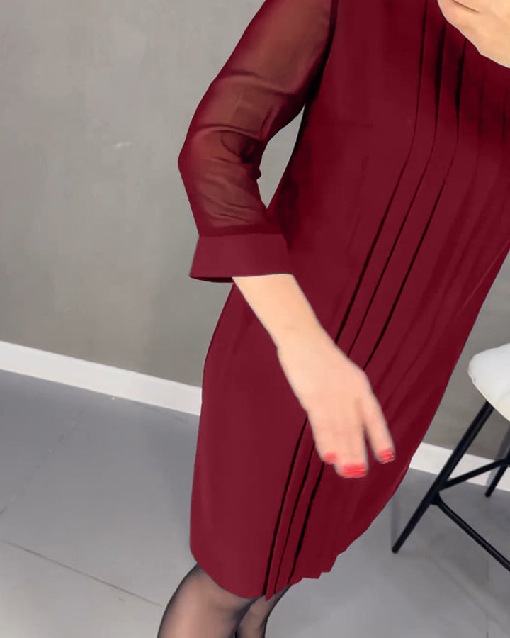 Elegant black women's shift dress with mesh detailing on long sleeves, ideal for versatile fall office fashion.