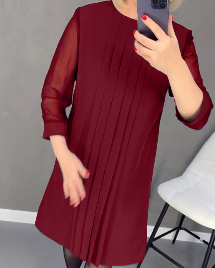 Women's fall fashion shift dress, elegant mesh panels & long sleeves, versatile for office or evening cocktail wear.
