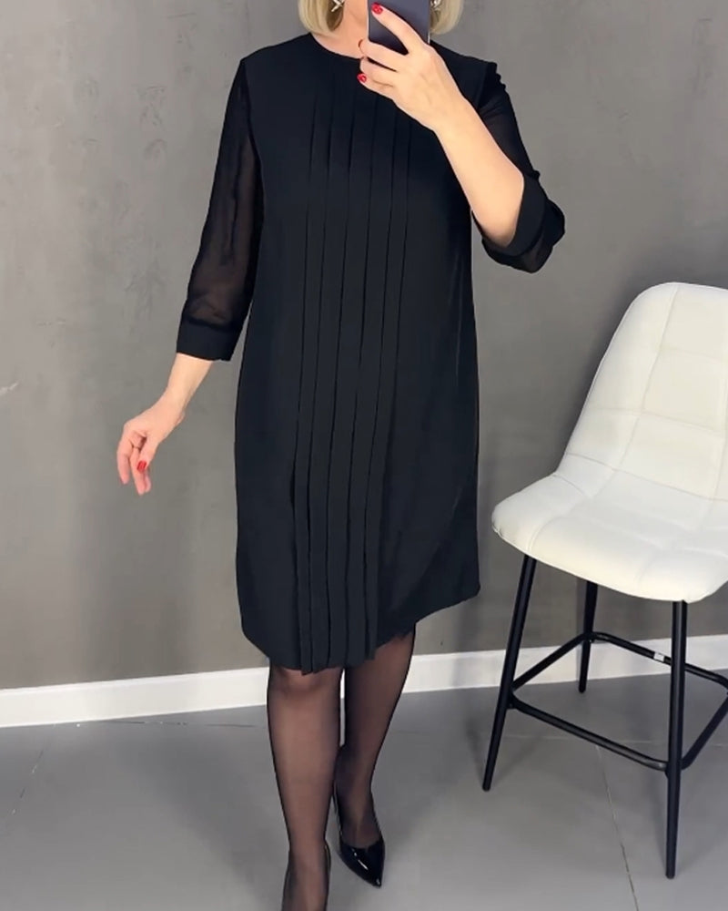 Elegant women's black shift dress with mesh panels, knee-length & long sleeve, versatile for work or parties.