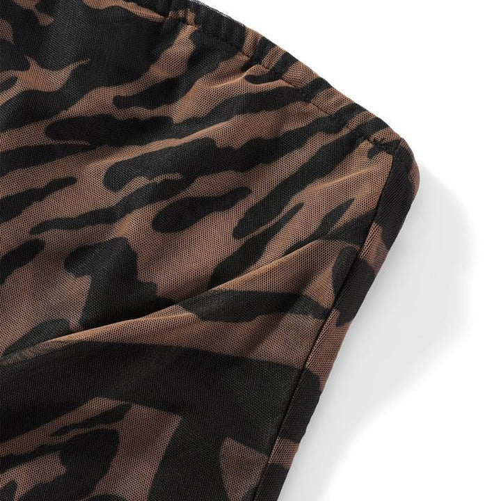 Glamorous strapless animal print chiffon maxi dress with a sophisticated front slit, ideal for elegant events