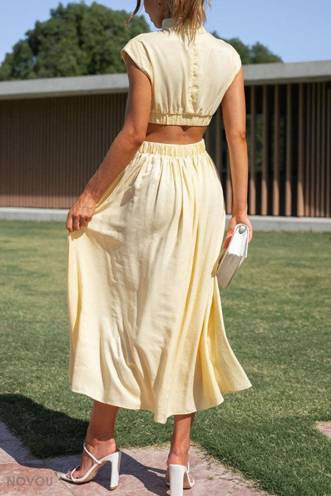 Women's flattering midi dress with a chic waist cut-out, ideal for elegant summer style.