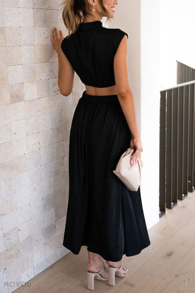 Women's elegant party midi dress, sleeveless with a stylish stand neck and waist cut-out.