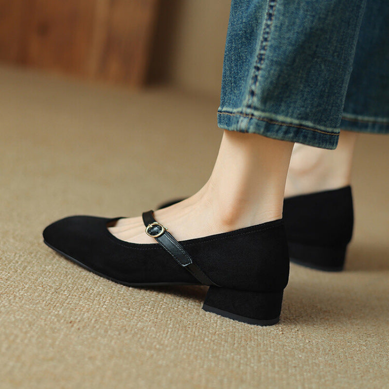 Zoomed-in texture of the high-quality suede on Women's tan block heel pumps, elegant detail.