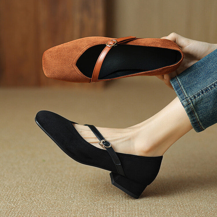 Women's versatile black suede block heel pumps, featuring a secure and stylish buckle strap.
