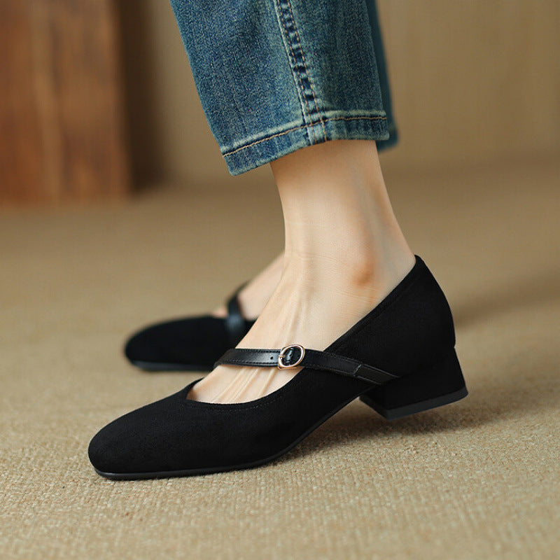 Pair of tan suede pumps with block heels, a comfortable and elegant footwear option for women.