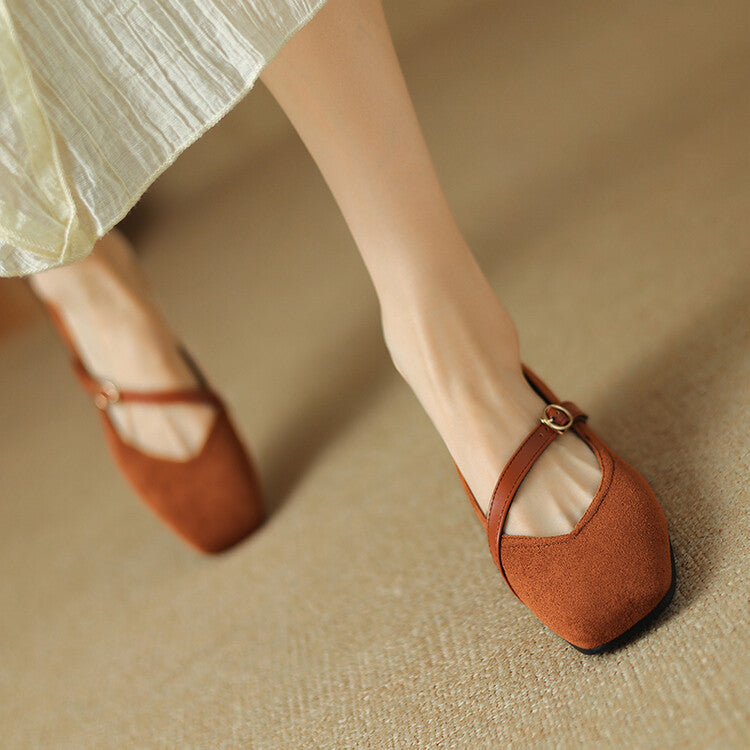 Women's black suede buckle strap block heel pumps, versatile and an elegant footwear choice.