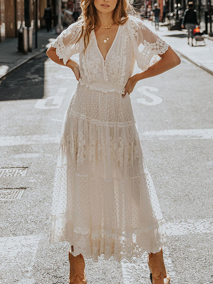 Elegant white V-neck A-line midi dress for women, featuring short sleeves and flowing style, perfect for summer occasions.