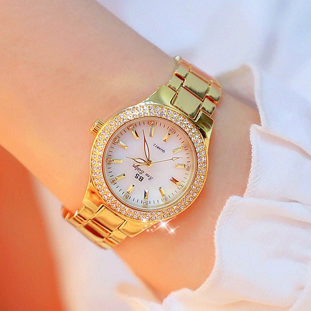 Close-up of a women's timeless stainless steel quartz watch on wrist, featuring a sleek 1.26" silver dial.