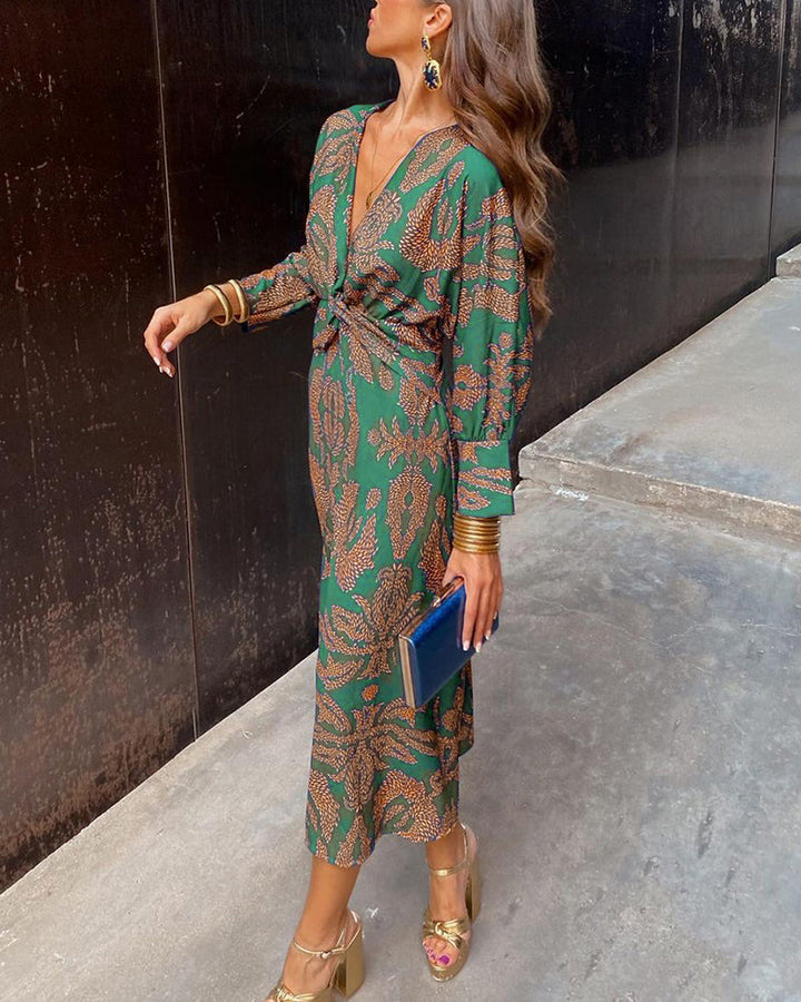 Formal women's printed maxi dress featuring a flattering A-line silhouette and a chic knot detail at the bust