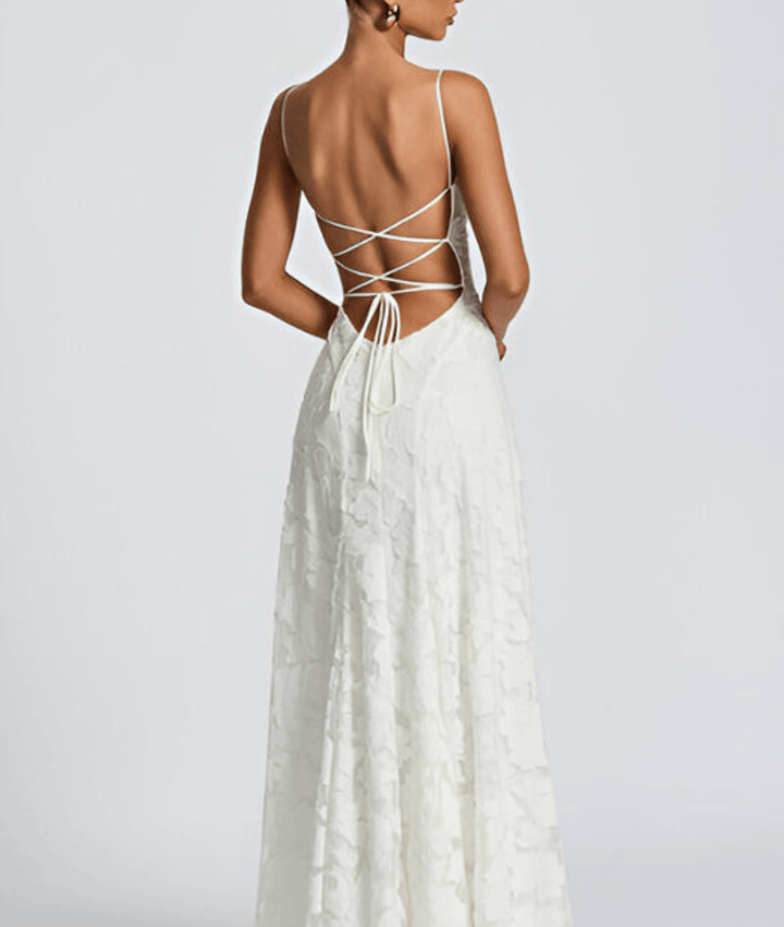 Sophisticated women's A-line maxi dress featuring delicate spaghetti straps. A graceful formal wear choice.