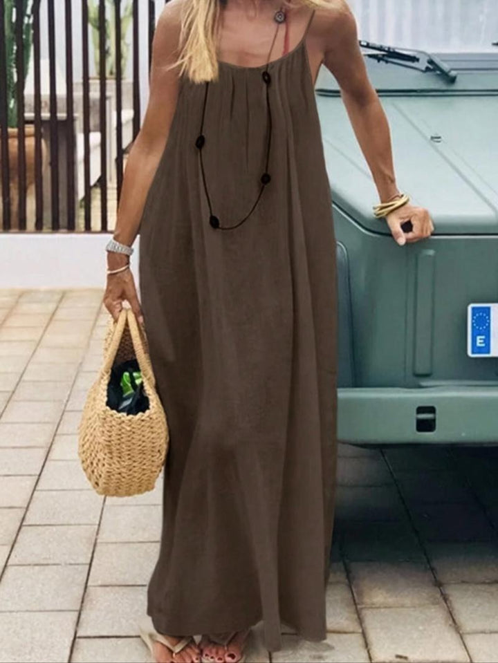 Detailed shot of the bodice and backless design of a women's cotton-linen maxi dress.