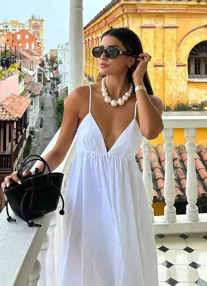 Elegant women's backless spaghetti strap maxi summer dress, perfect for beach, vacation or evening wear.