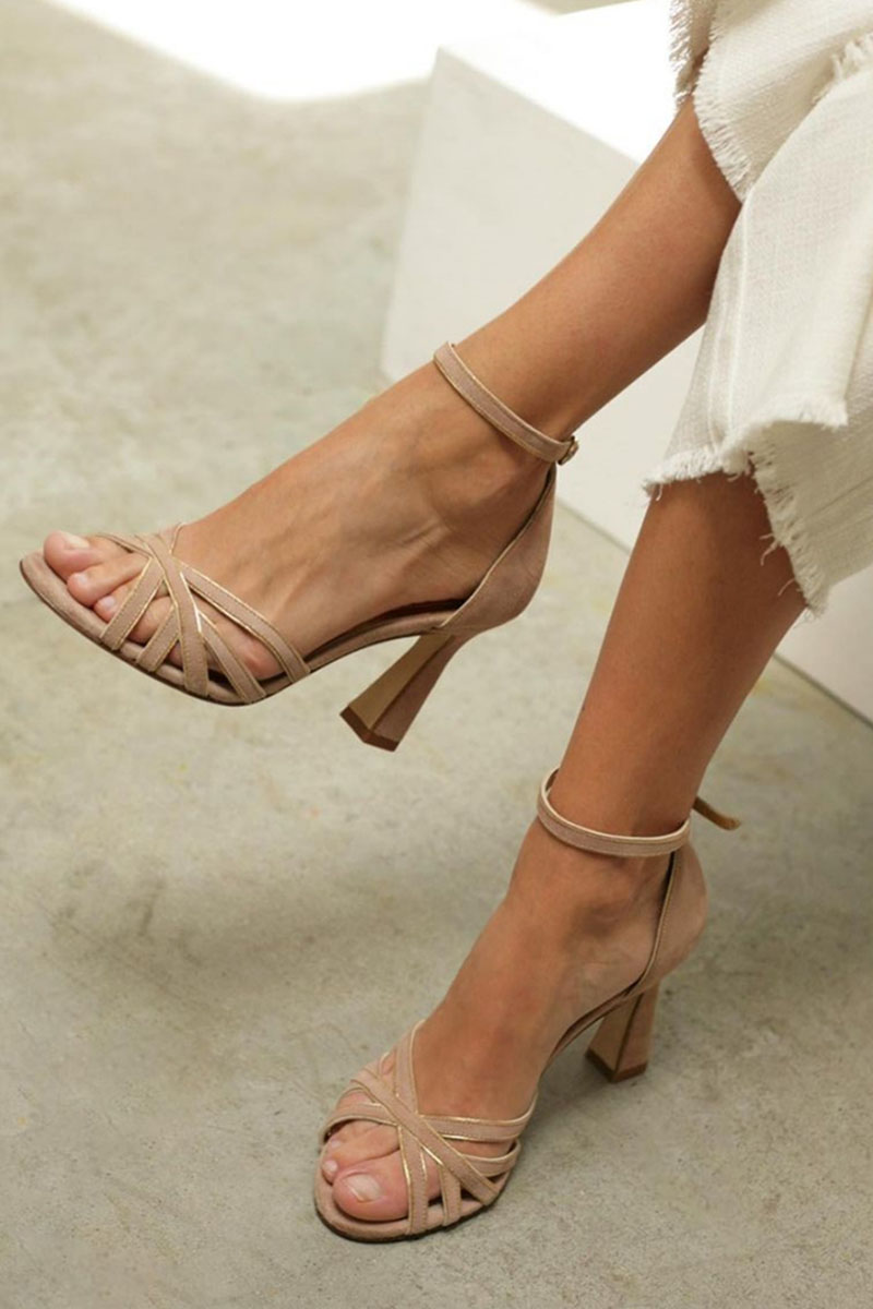 Elegant women's beige peep toe heeled sandals with an ankle strap, ideal for dressy occasions or summer evenings.