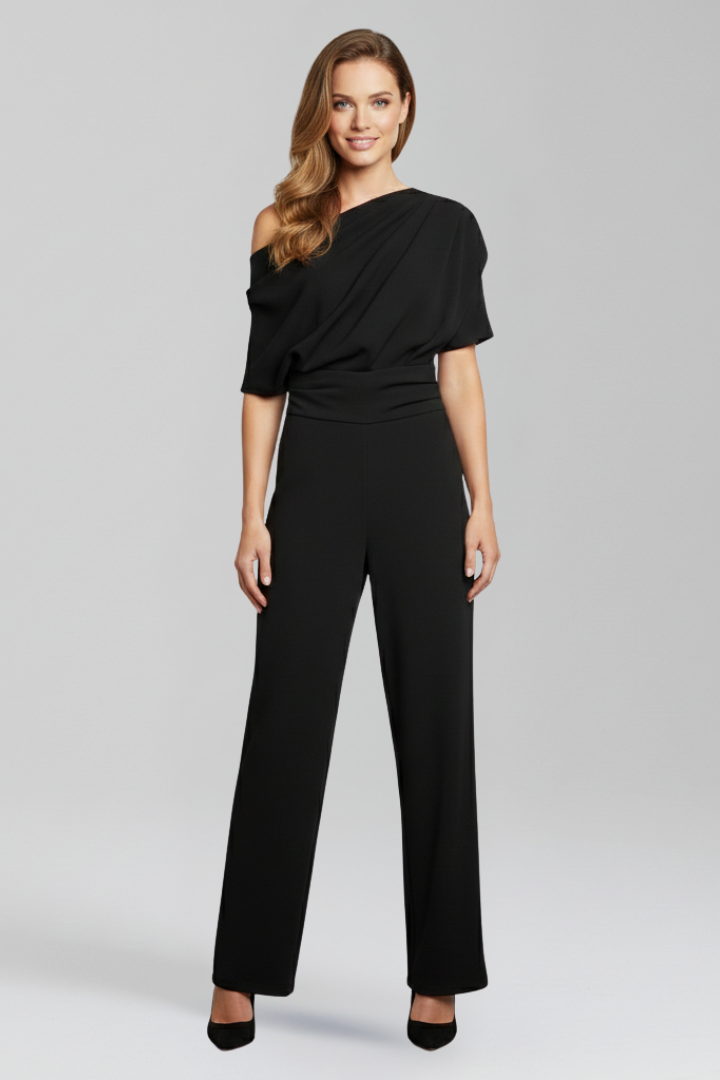 Stylish women's wide leg jumpsuit in white. Features an asymmetric design and long sleeves for a versatile, modern look.