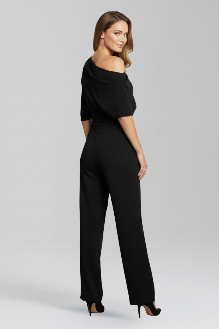 Modern women's black jumpsuit featuring an elegant asymmetric design, long sleeves, and a flattering wide leg fit.