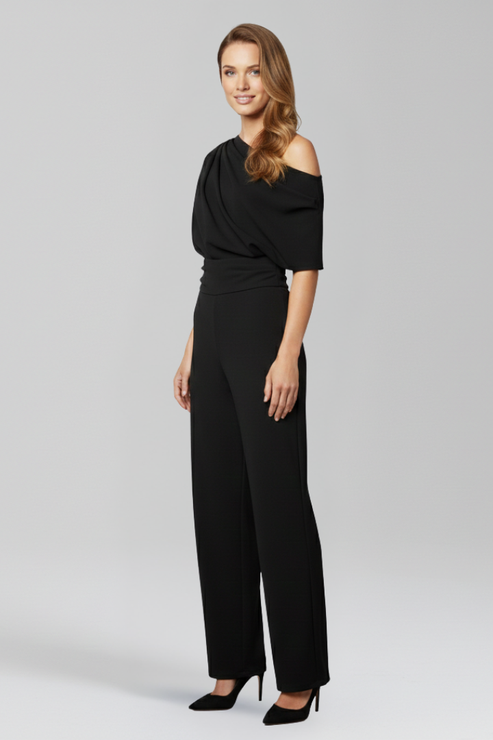 Chic women's wide leg jumpsuit with an asymmetric top. Long sleeves make this one-piece perfect for any elegant event.